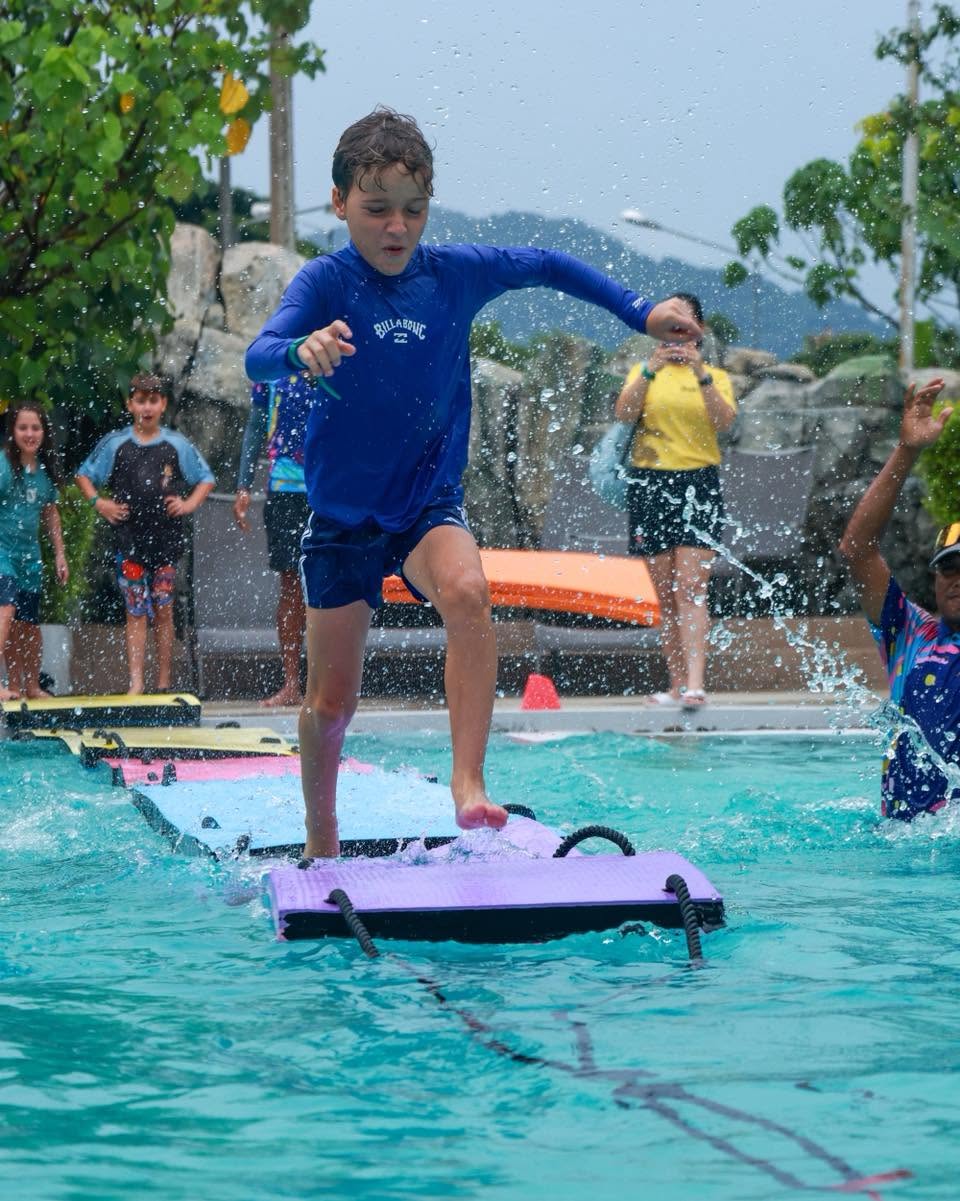 Lighthouse International School student running towards the pool